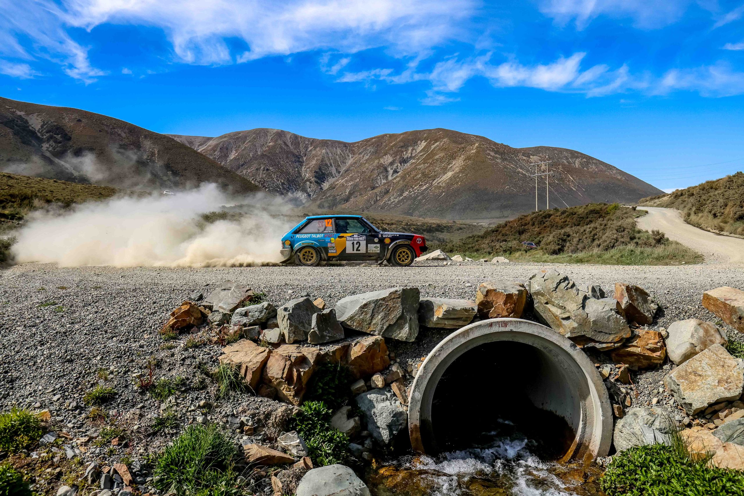 Historic competition car attacking a gravel stage at the Silver Fern Rally