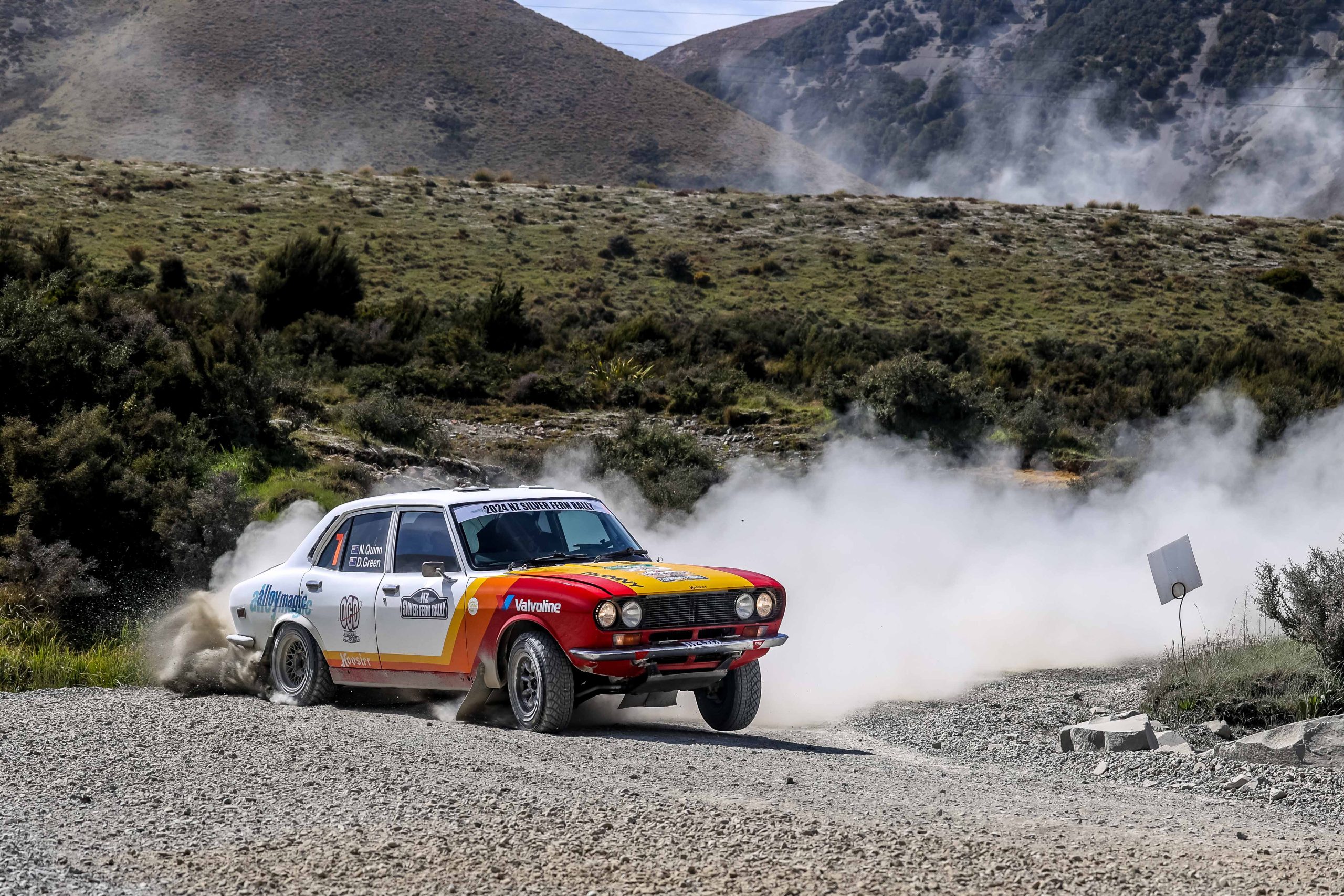 Classic rally car on loose gravel