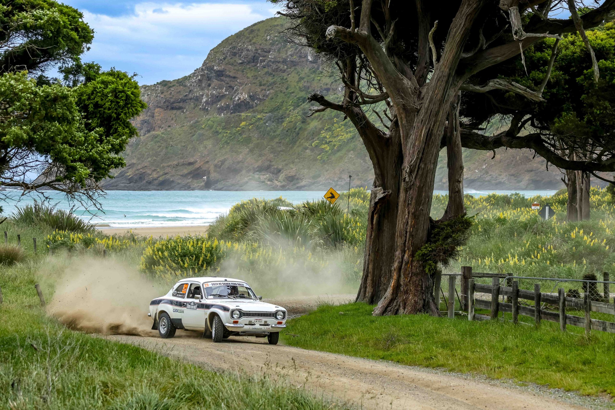 2WD car cutting through a gravel corner